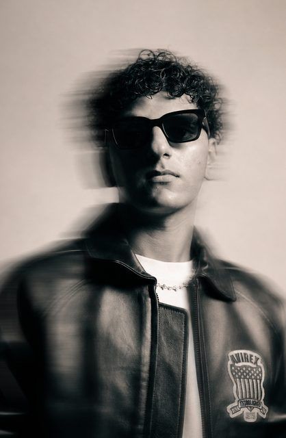 Editorial black-and-white portrait with motion blur